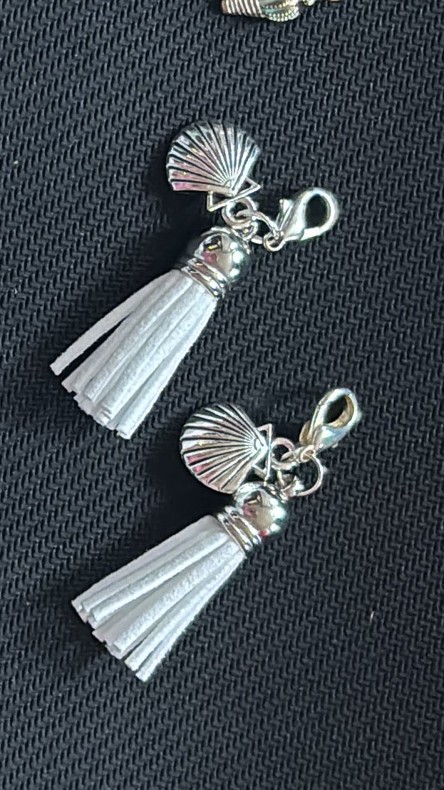 White small suede tassel bag charm with seashell
