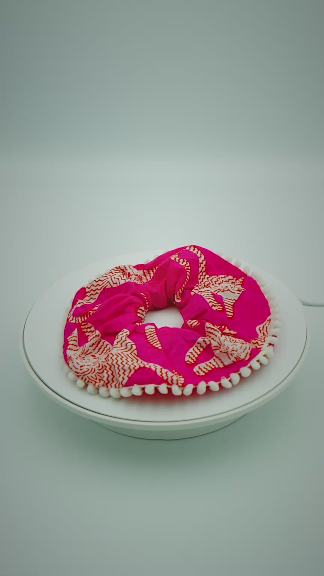 Load video: Hot Pink Tiger Scrunchie  with Pom Pom Trim