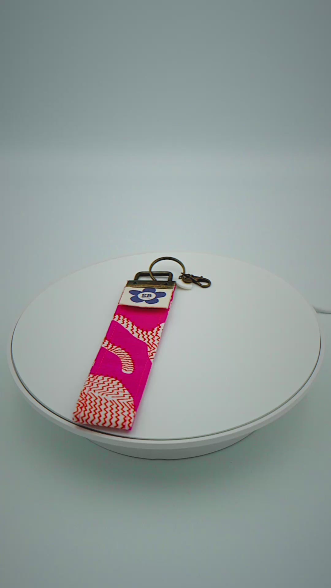 Load video: Hot pink Indian Tiger Keychain wristlet