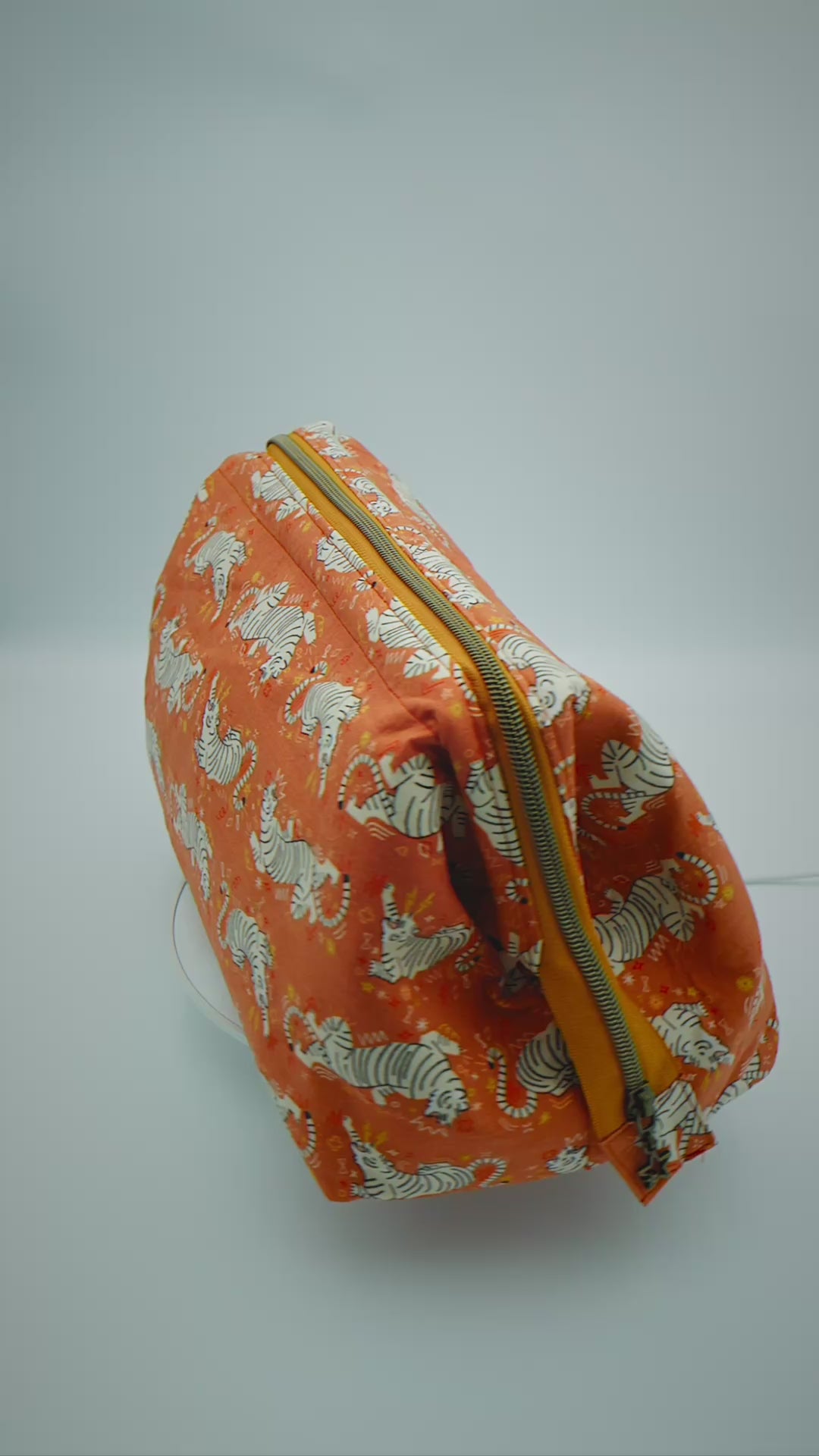 Load video: Large Tiger Print Wash Bag orange